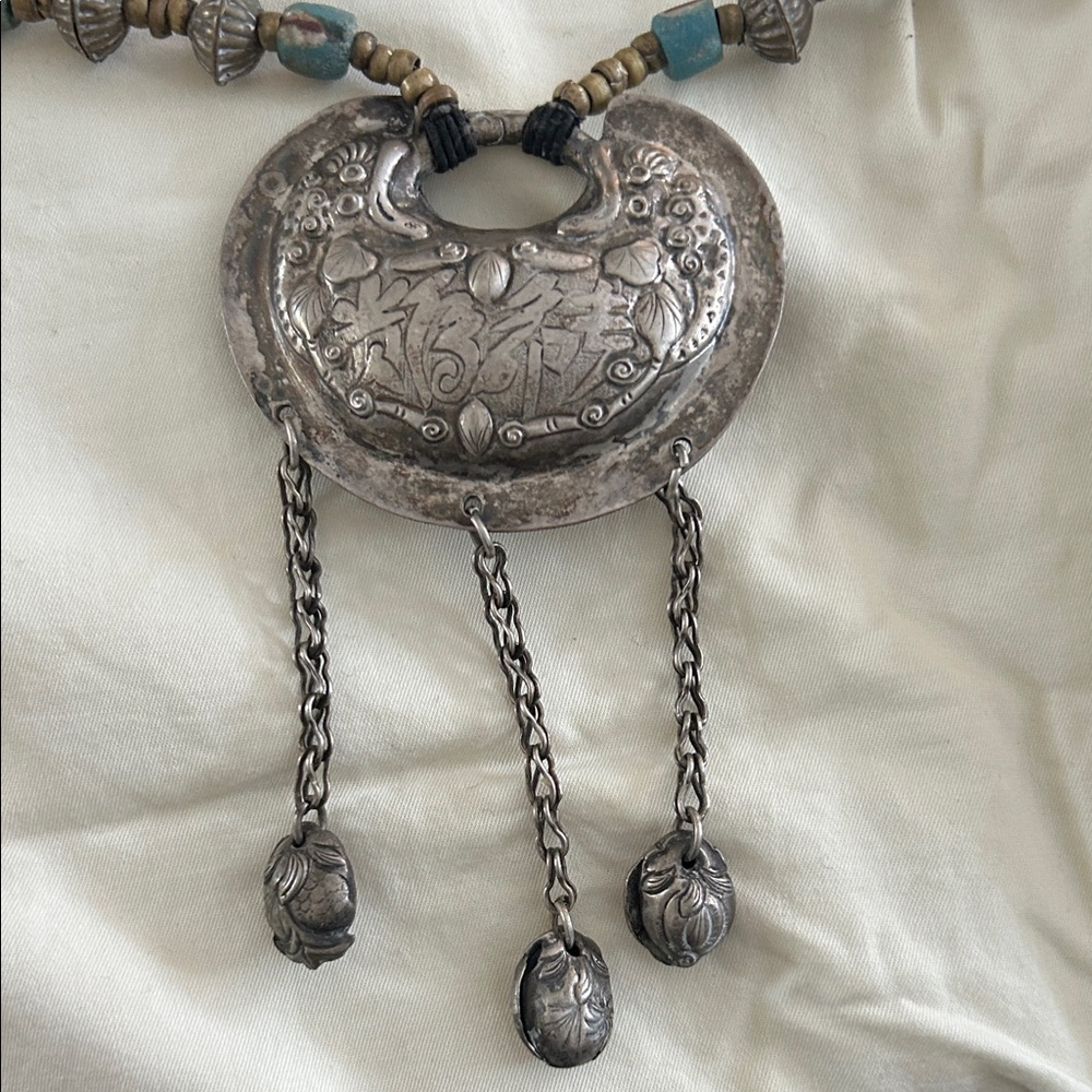 Exotic foreign Pendant Necklace with Beaded Chain and inscised plant design.